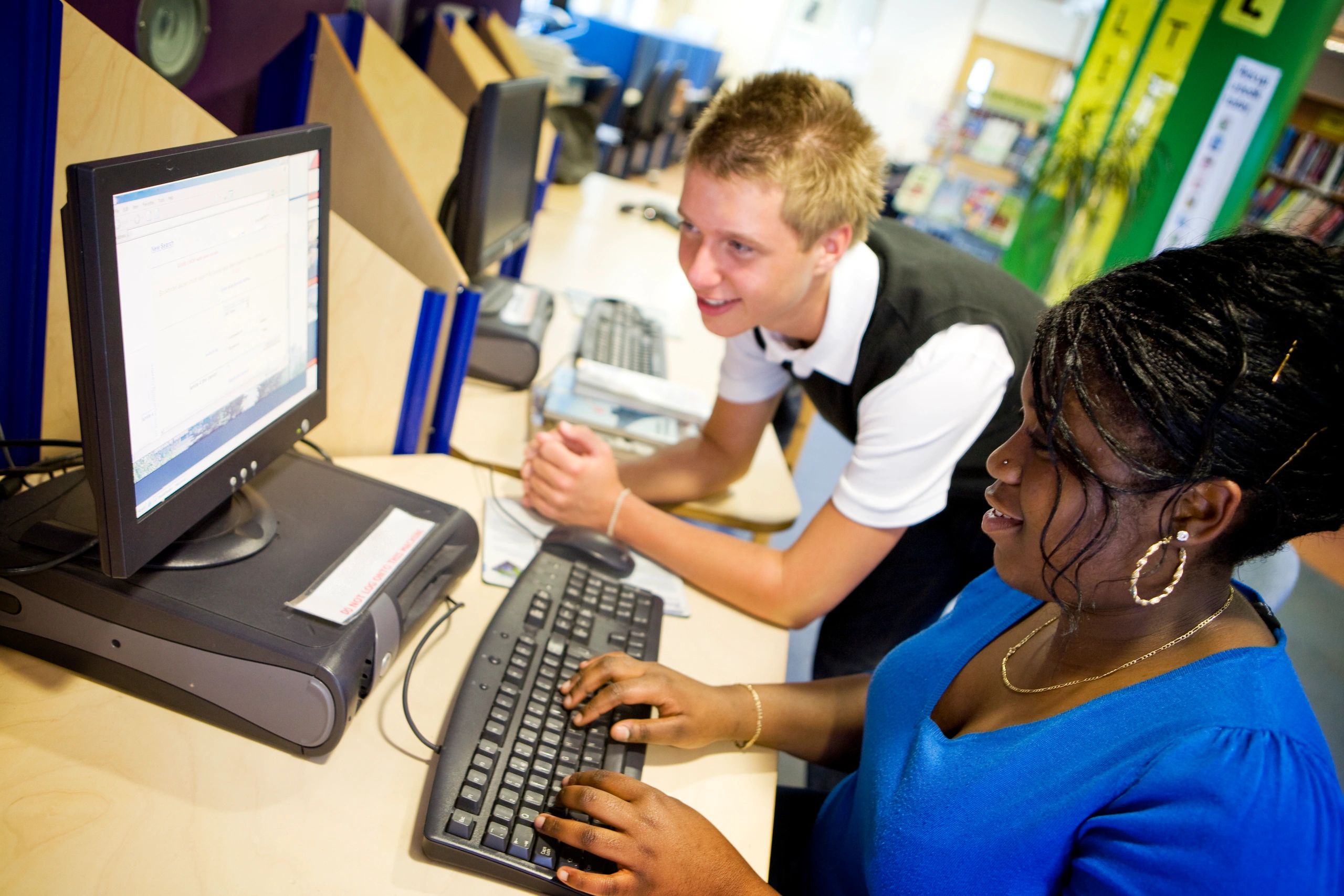 Teenage students collaborating online for a school project