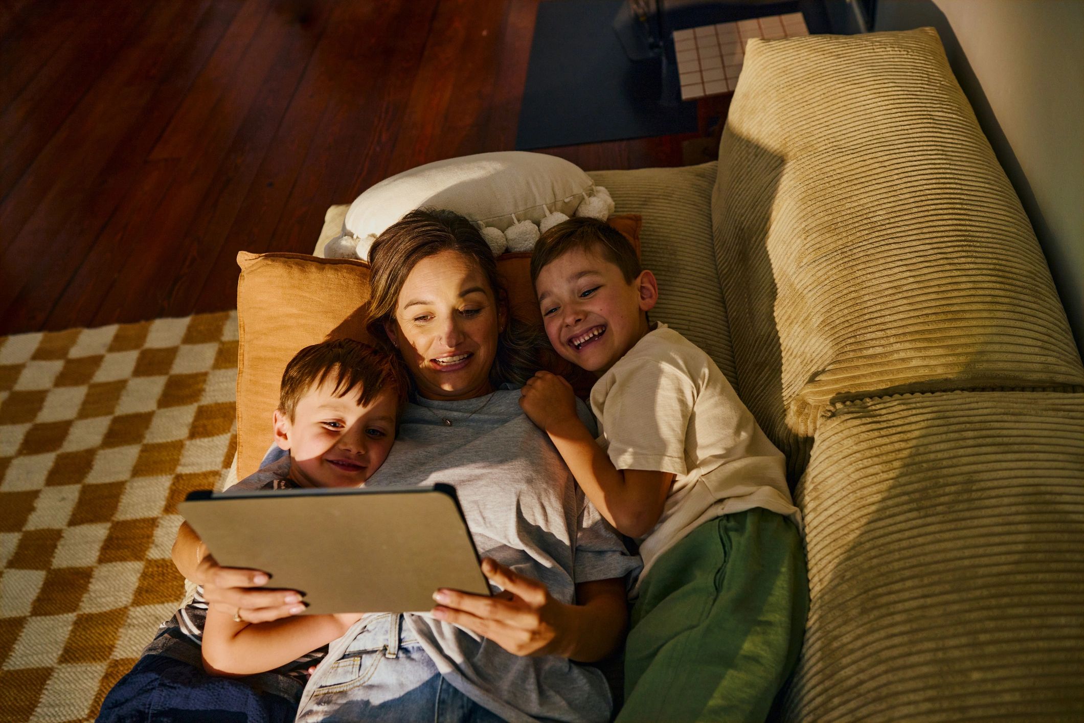 Family learning together with a tablet at home